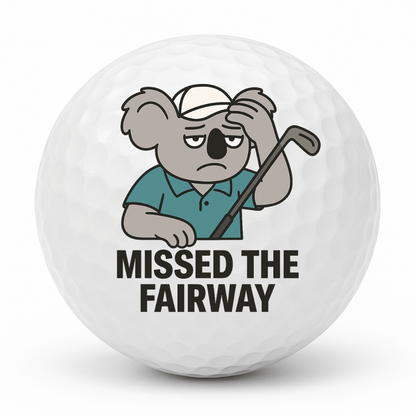 Tired koala scratching his head with the text Missed The Fairway printed on a novelty golf ball.