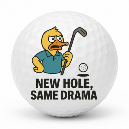 Angry duck golfer pointing his club at a golf ball with the text New Hole Same Drama printed on a novelty golf ball.
